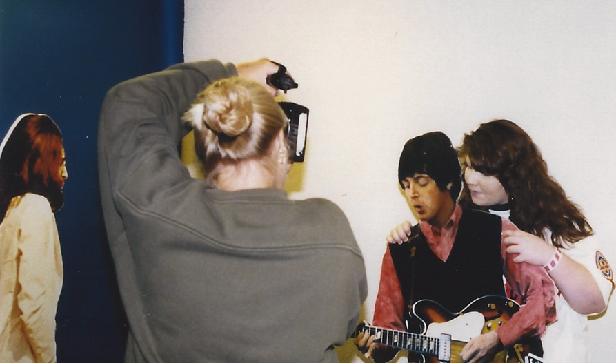 John looks on as a fan hugs Paul – Chicago `98