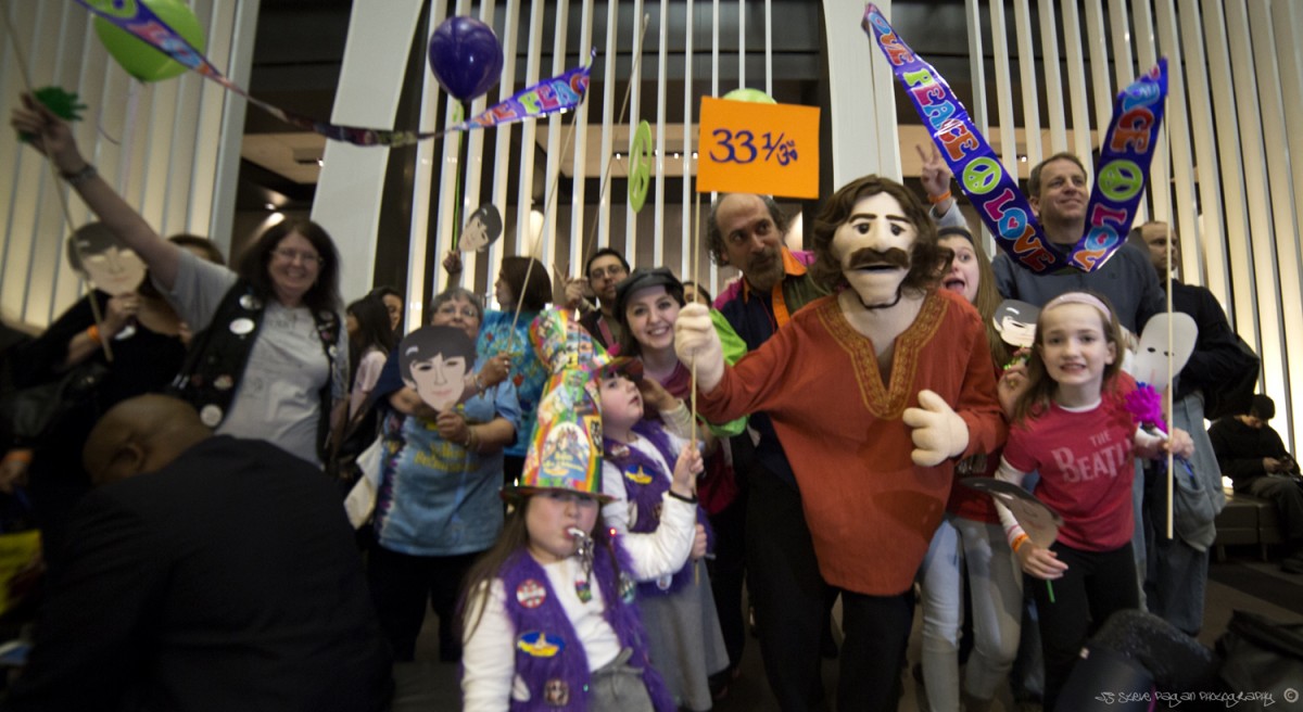 Bob Abdou and the puppets lead the parade through the Hyatt on Saturday.