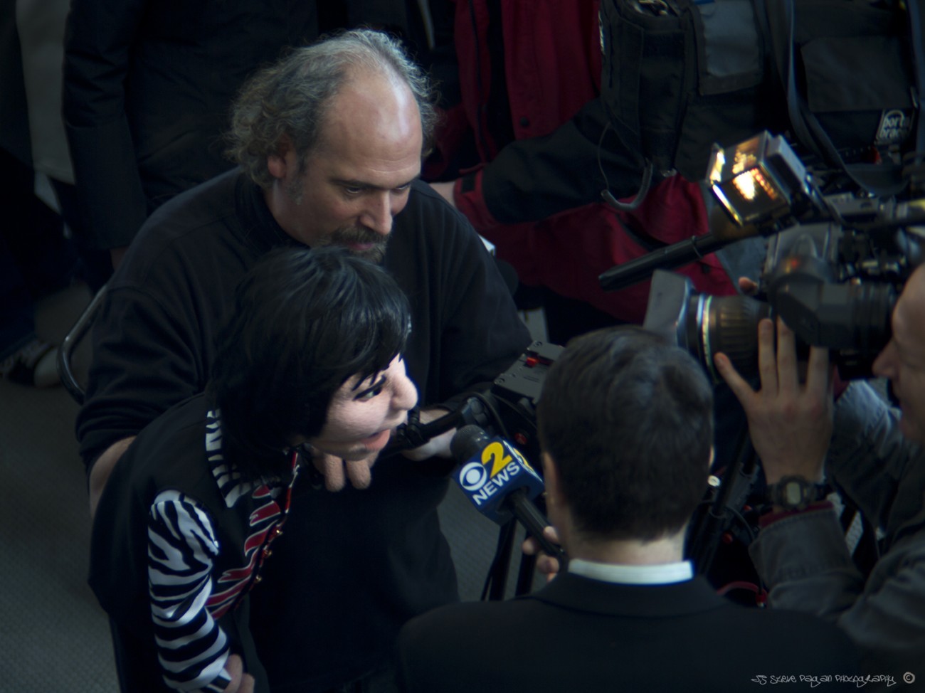 Paul McCartney (with a little help from Bob Abdou) gives an interview to CBS at JFK Airport.