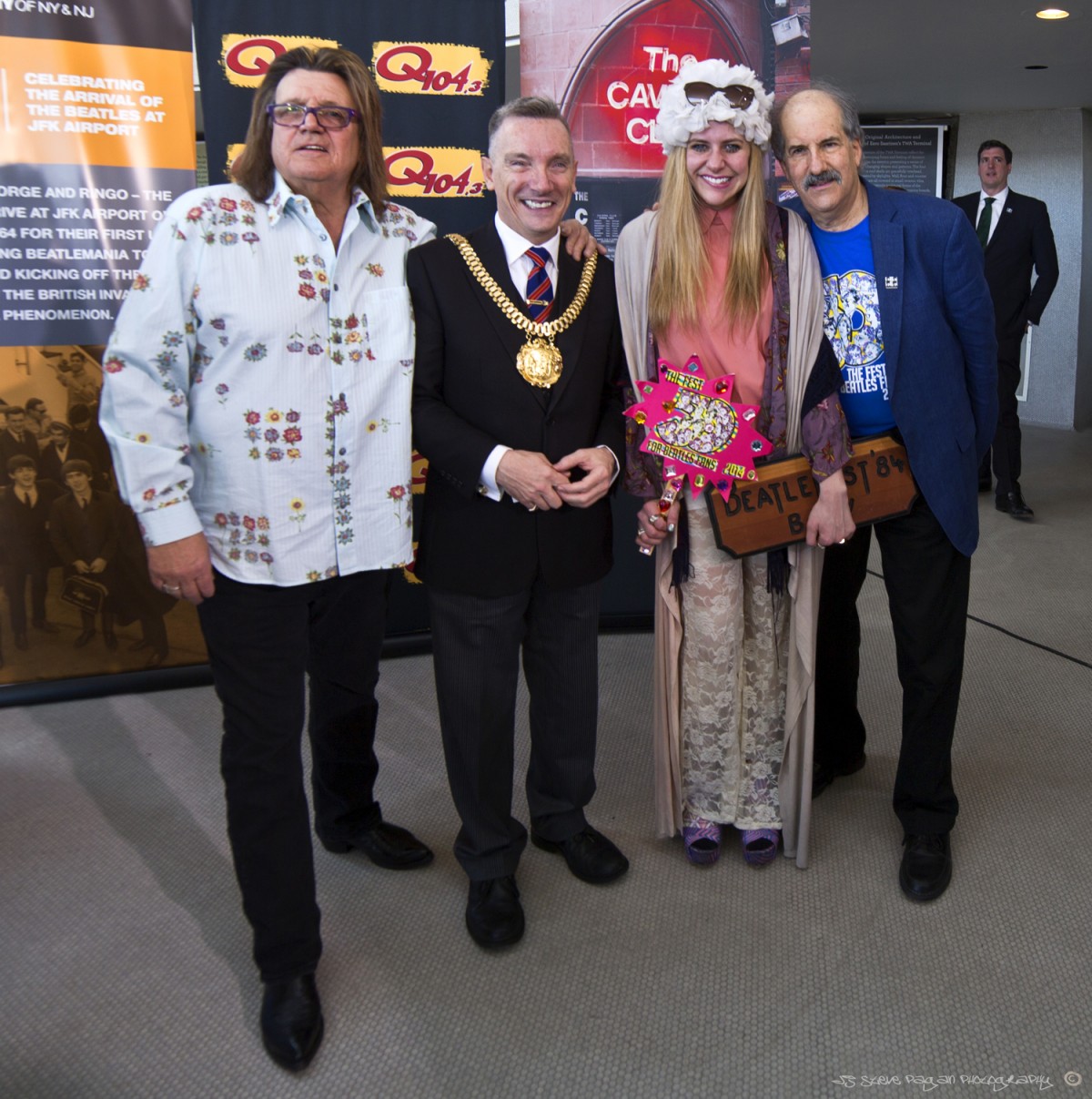 Billy J. Kramer, the Lord Mayor of Liverpool, Michelle Lapidos, and Mark Lapidos pose for a shot during the JFK Airport trip.